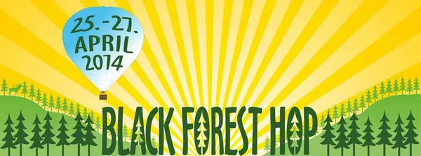 Black Forest Hop Festivalbanner, 25.–27. April 2014, Freiburg: gelber Strahlenkranz, Heißluftballon und grüne Waldhügel